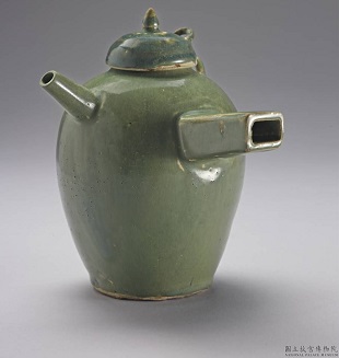 Green glazed single handled pot