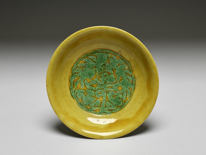 Dish with tree decoration in the shape of “shou” (longevity) character in green on the yellow ground