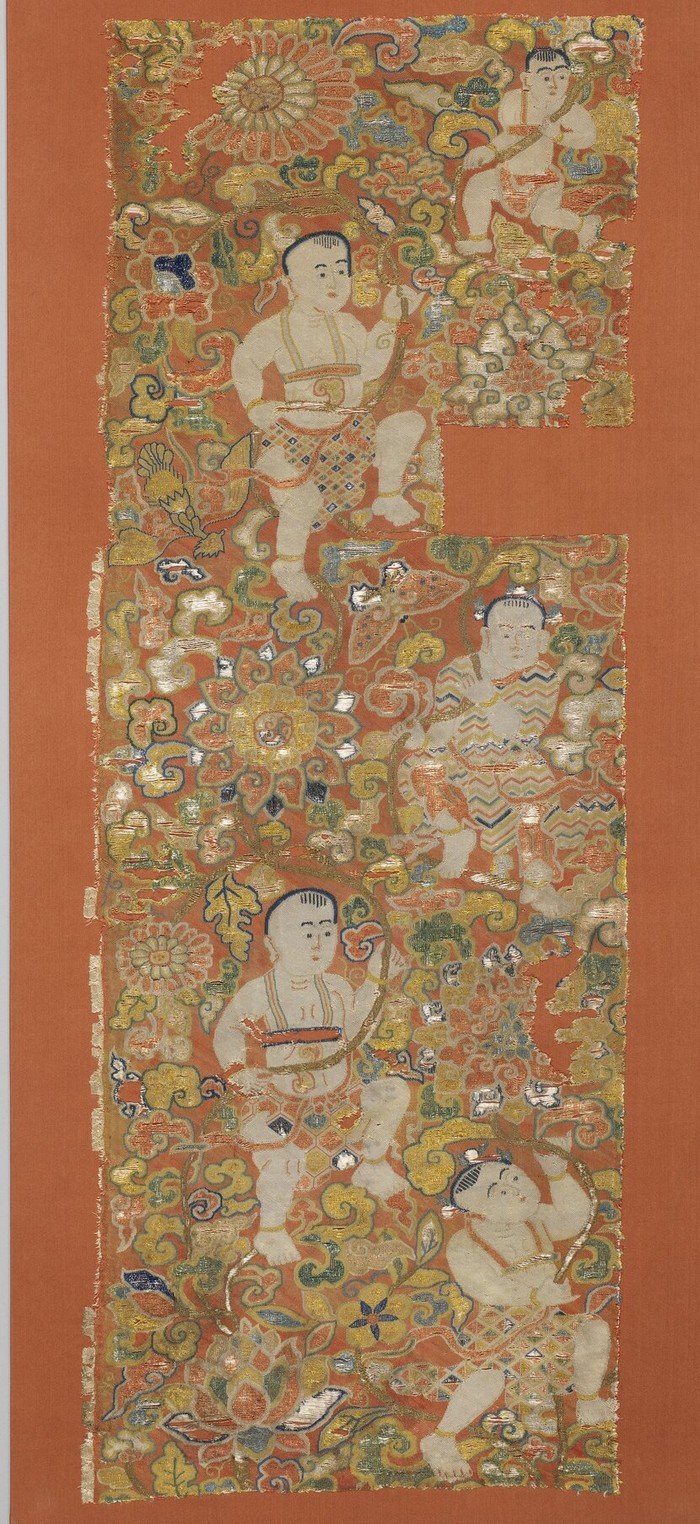 Embroidery featuring children holding lotuses