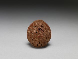 Walnut shell carving in the shape of a flower basket, by Chen Ziyun