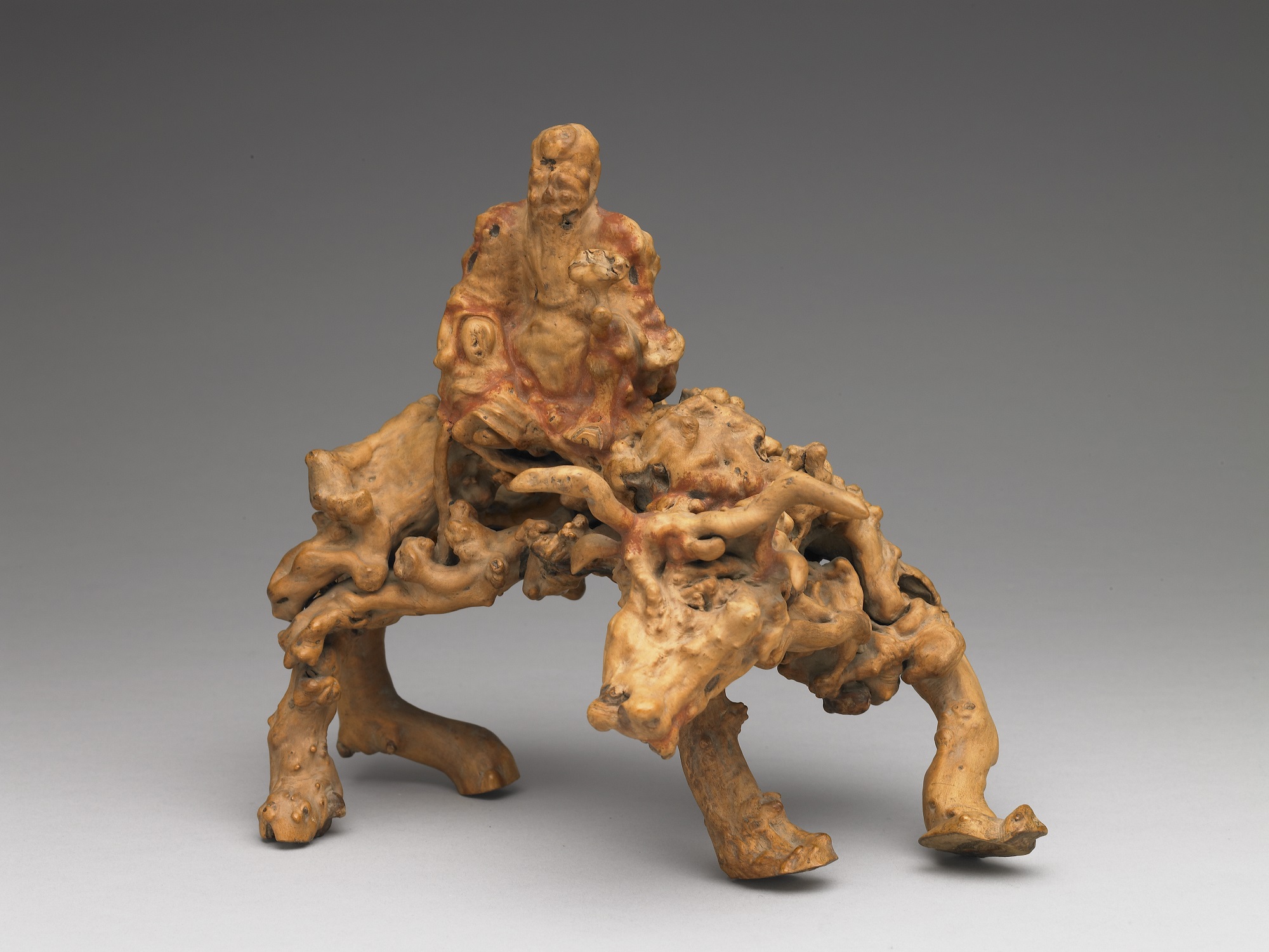 Burls sculpture of Laozi riding a water buffalo