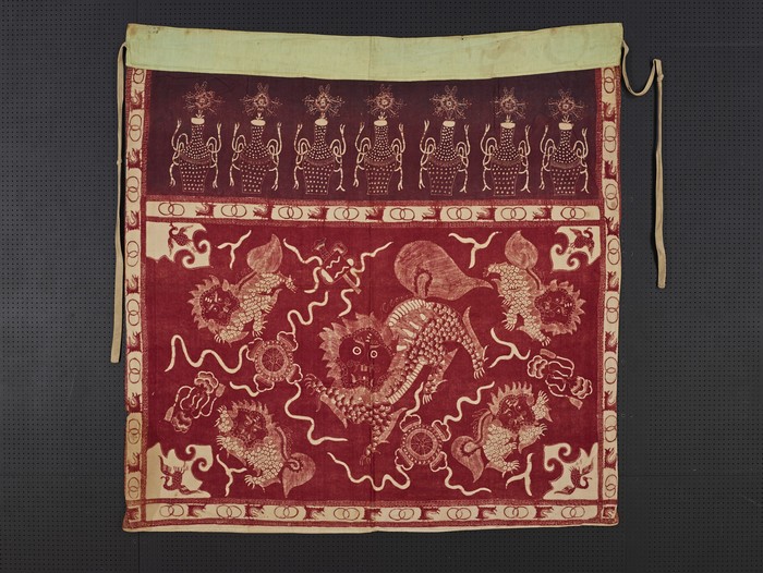 Red tokwi (altar frontal) with motif of lion playing with balls